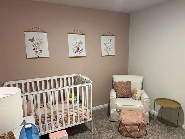 a bedroom with furniture and a window