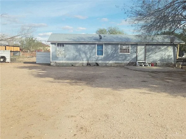 a view of a house with a street