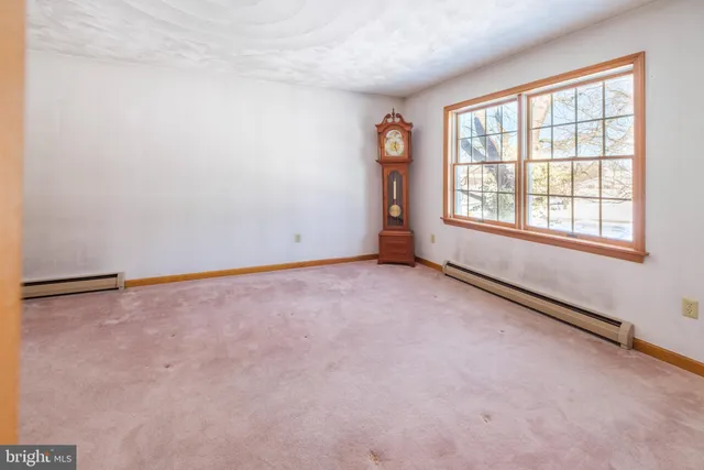 an empty room with closet area