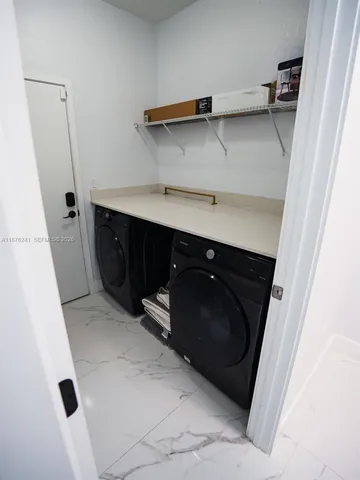 a bathroom with a shower and a sink