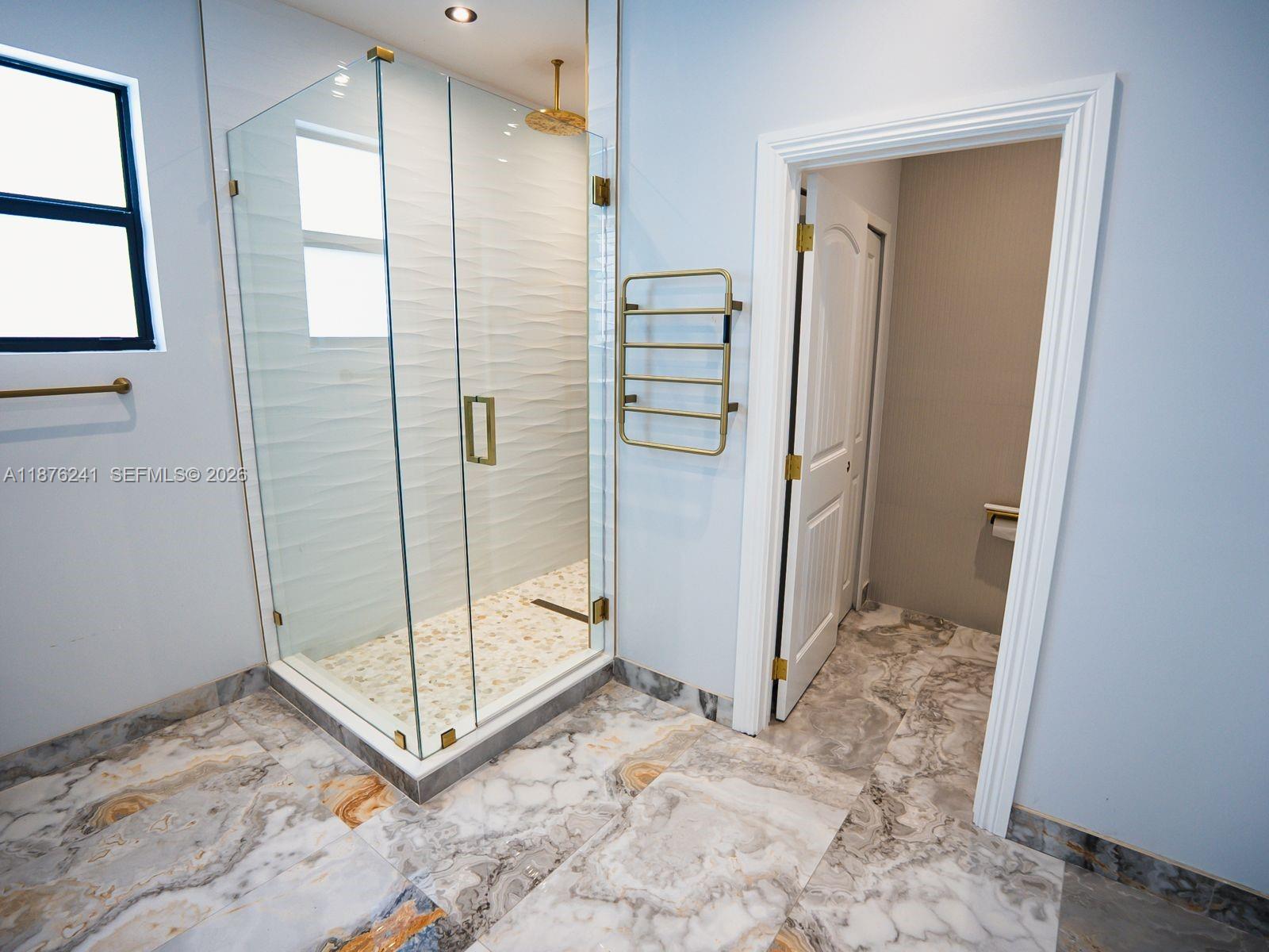 14478 Southwest 21st Street Miami, FL 33175 - Photo 23 of 42 a bathroom with a shower and a sink