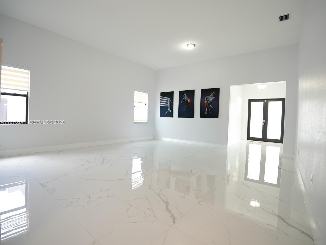 14478 Southwest 21st Street Miami, FL 33175 - Photo 36 of 42 a view of empty room with windows