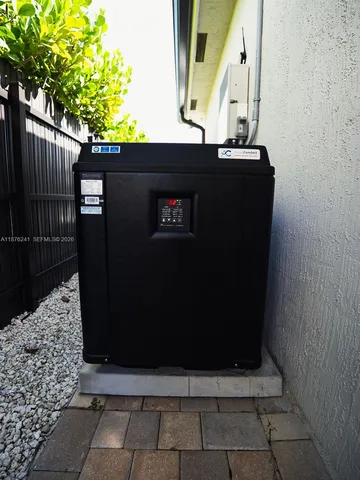 a view of a house with swimming pool and a yard