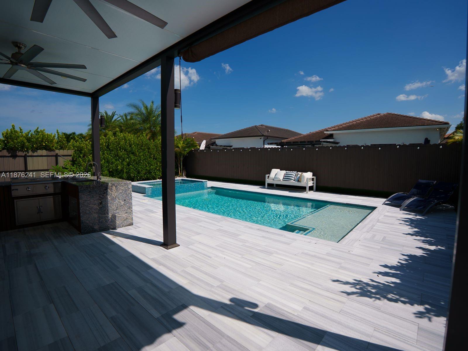 14478 Southwest 21st Street Miami, FL 33175 - Photo 8 of 42 a view of a terrace with a yard