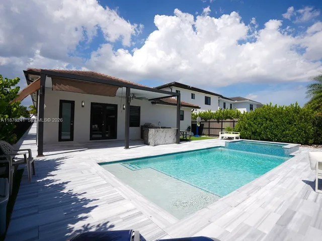 a bathroom with a sink a toilet and a shower