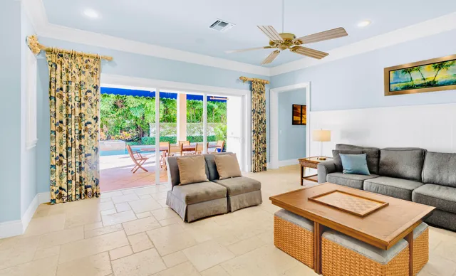 a view of a dining room with furniture and a chandelier