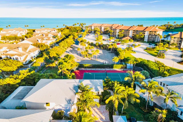 a view of a chair and table in the balcony
