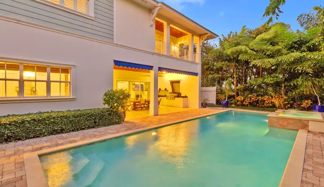a dining area with a table and chairs