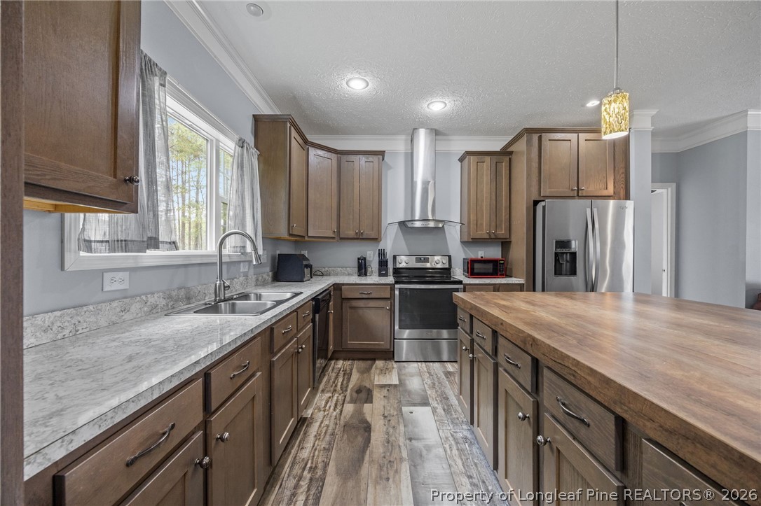 2252 Old Stage Road South Erwin, NC 28339 - Photo 8 of 47 a kitchen with stainless steel appliances granite countertop a sink refrigerator and cabinets