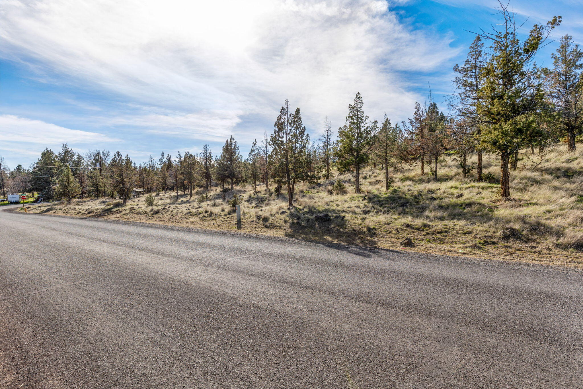 Southwest Roberta Drive Madras, OR 97741 - Photo 2 of 11 a view of a road with a building in the background