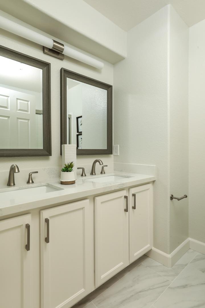 2105 Showers Drive Mountain View, CA 94040 - Photo 13 of 26 a bathroom with a double vanity sink and mirror