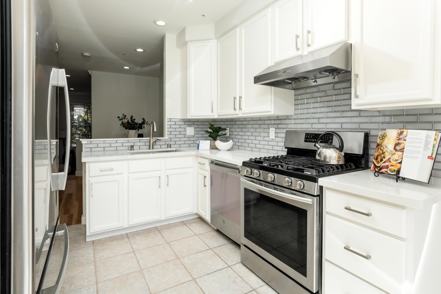 2105 Showers Drive Mountain View, CA 94040 - Photo 9 of 26 a kitchen with a stove top oven and sink