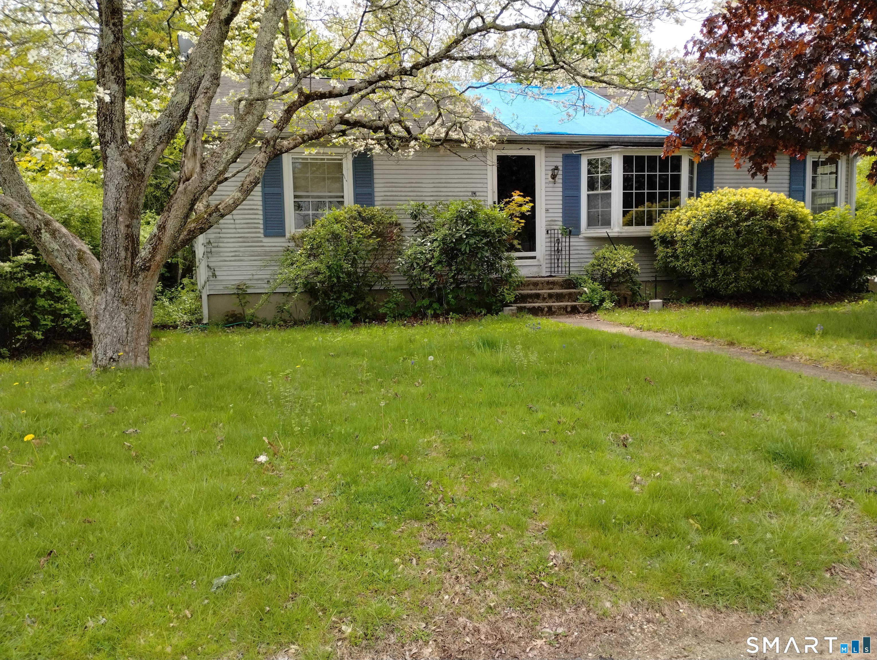 37 Ruth Street Killingly, CT 06239 - Photo 2 of 9 a front view of a house with a garden
