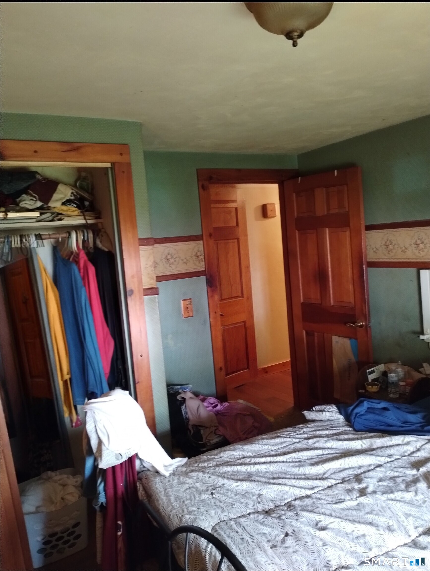 37 Ruth Street Killingly, CT 06239 - Photo 7 of 9 a bedroom with a bed and a closet