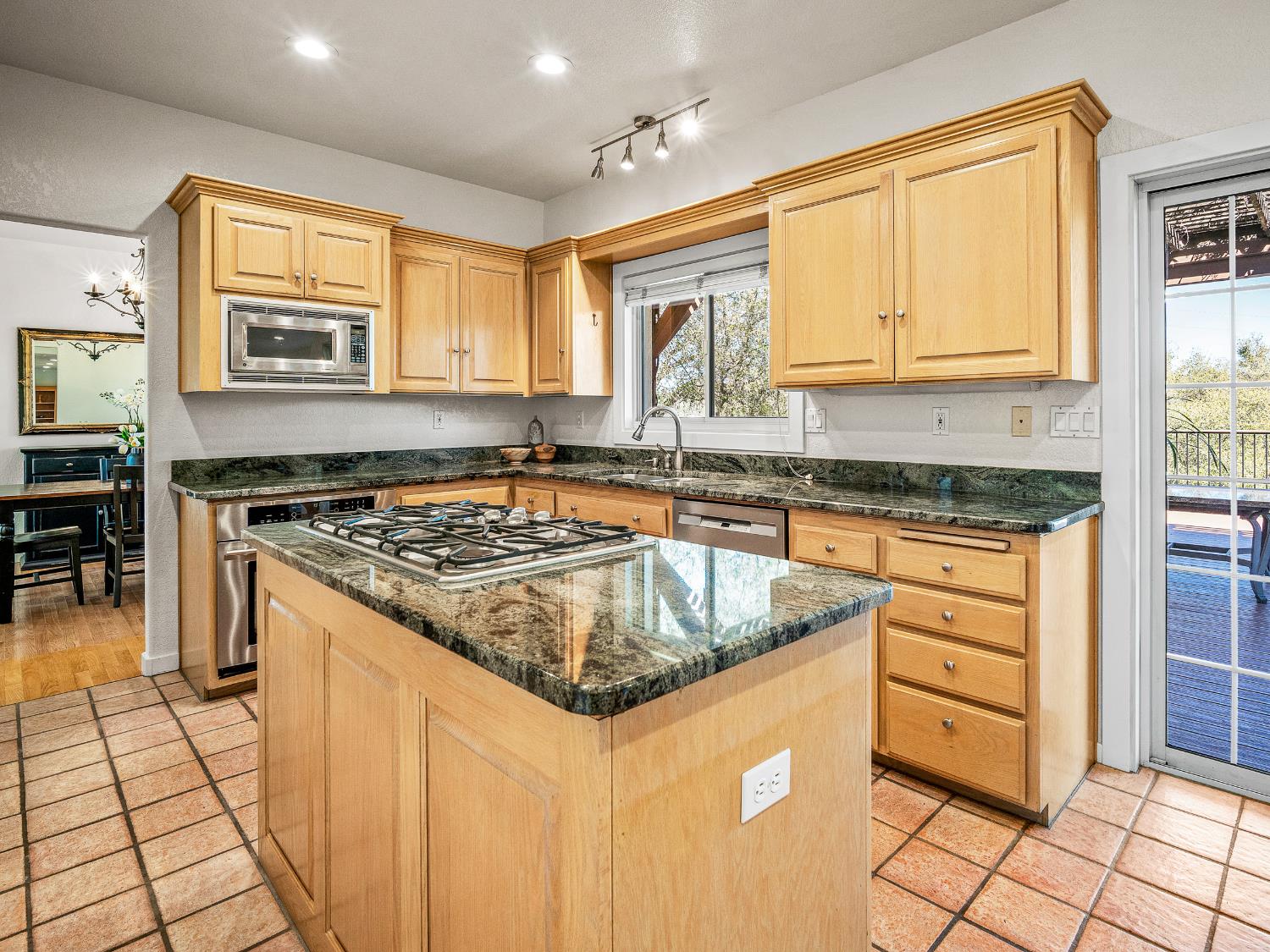 5373 Prairie Loop Placerville, CA 95667 - Photo 11 of 32 Granite topped kitchen over terra cotta tile floors.