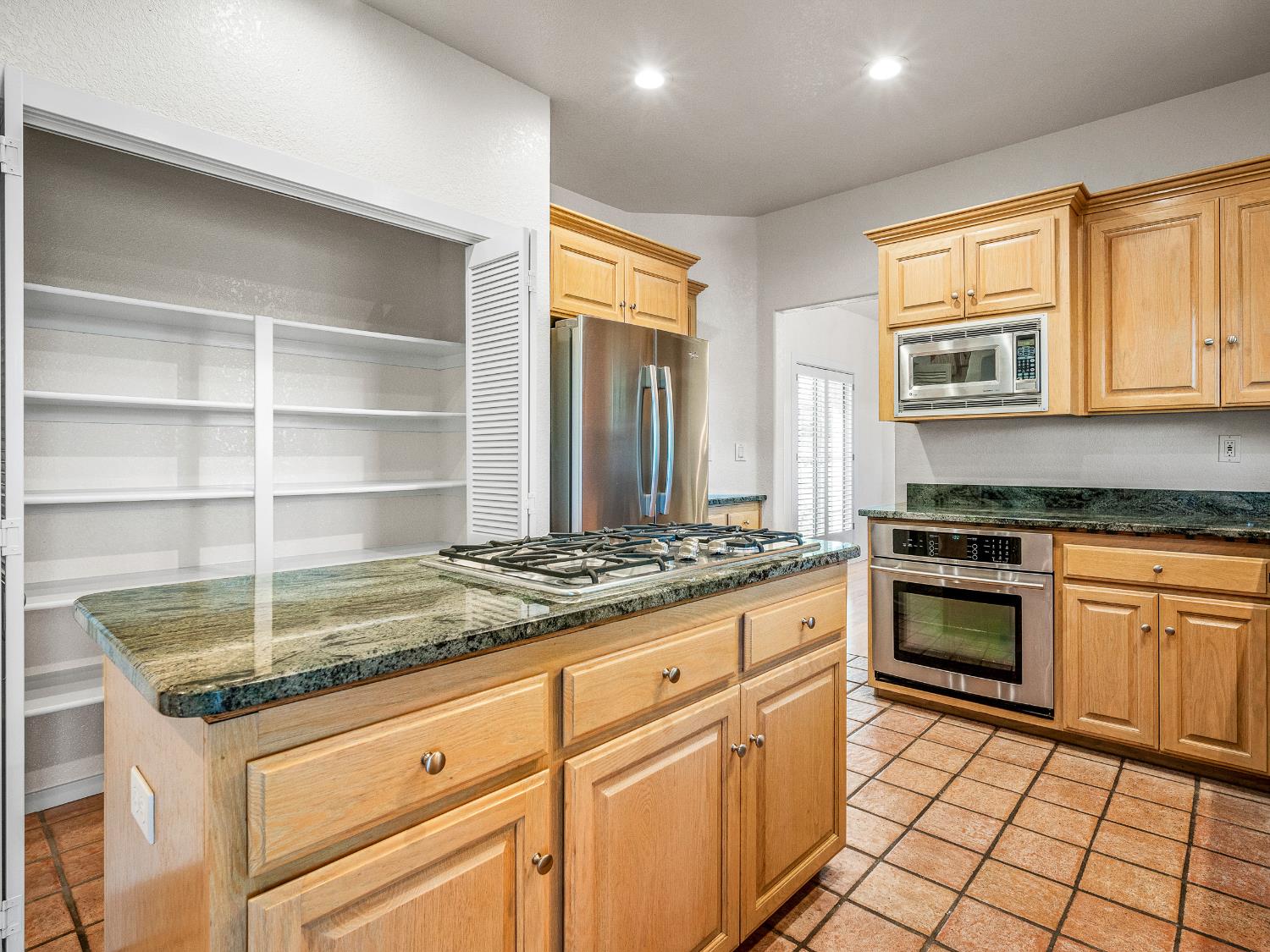 5373 Prairie Loop Placerville, CA 95667 - Photo 13 of 32 Lots of pantry cabinet space behind the island.
