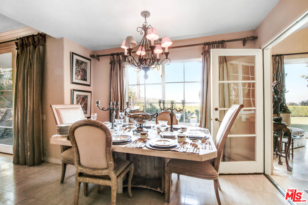 12535 Promontory Road Los Angeles, CA 90049 - Photo 11 of 42 a view of a dining room with furniture window and outside view