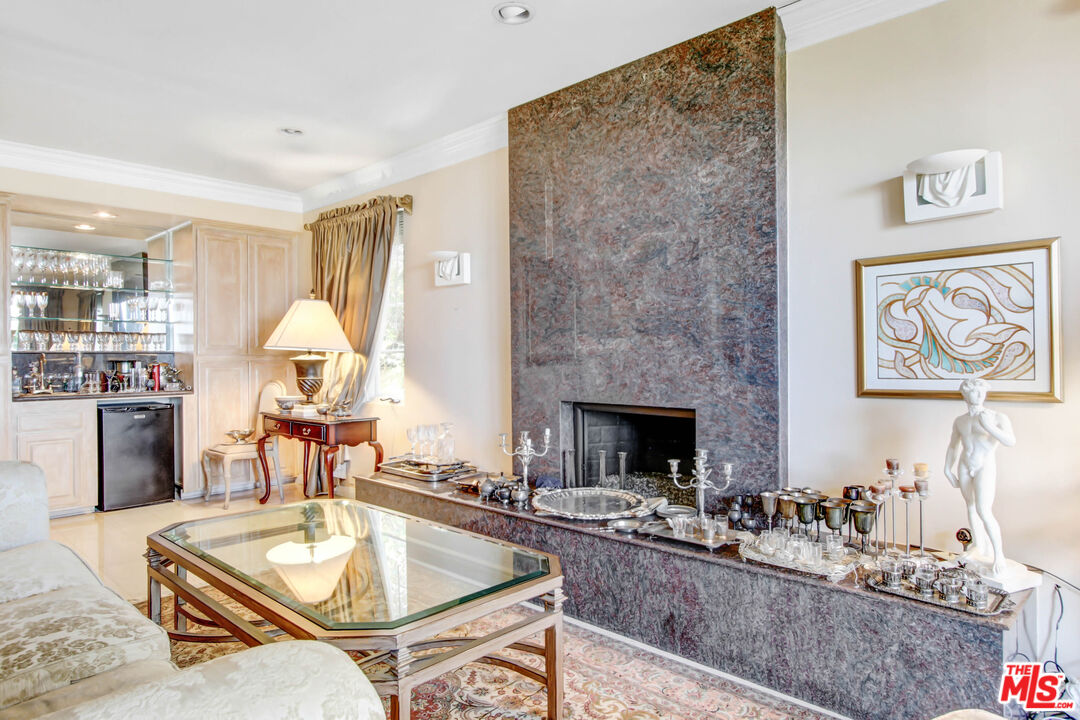 12535 Promontory Road Los Angeles, CA 90049 - Photo 18 of 42 a living room with fireplace furniture and a fireplace