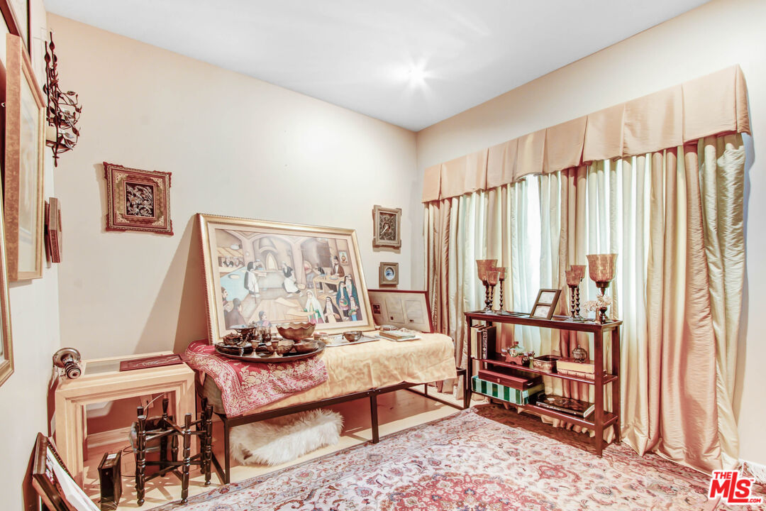 12535 Promontory Road Los Angeles, CA 90049 - Photo 21 of 42 a living room with furniture and a window