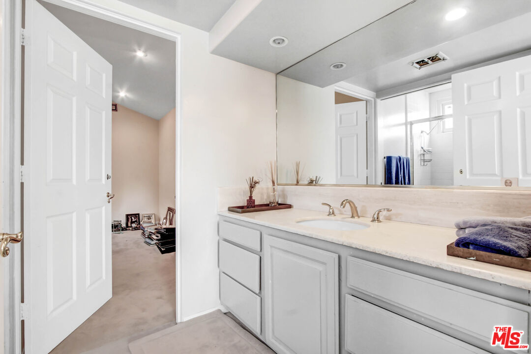 12535 Promontory Road Los Angeles, CA 90049 - Photo 24 of 42 a bathroom with a sink and a mirror