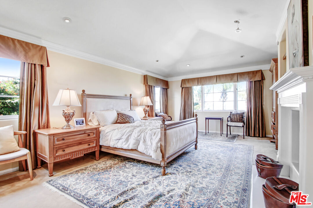 12535 Promontory Road Los Angeles, CA 90049 - Photo 27 of 42 a bed room with a bed and a window