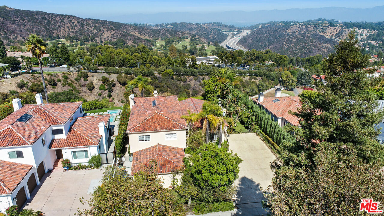 12535 Promontory Road Los Angeles, CA 90049 - Photo 37 of 42 an aerial view of residential houses with outdoor space
