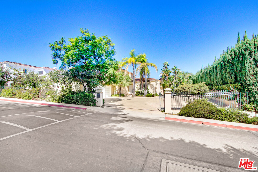 12535 Promontory Road Los Angeles, CA 90049 - Photo 4 of 42 a view of street with houses