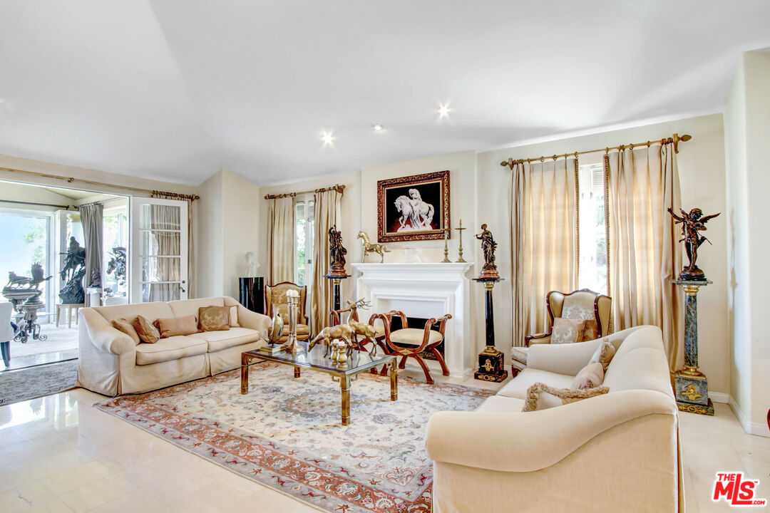 12535 Promontory Road Los Angeles, CA 90049 - Photo 6 of 42 a living room with furniture and a large window