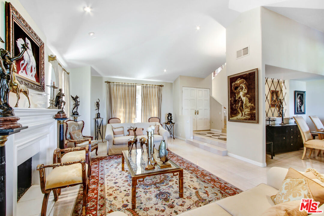 12535 Promontory Road Los Angeles, CA 90049 - Photo 7 of 42 a living room with furniture and a rug