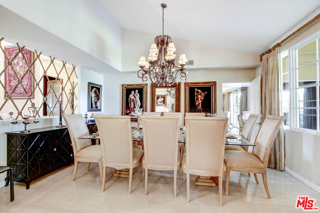 12535 Promontory Road Los Angeles, CA 90049 - Photo 8 of 42 a dining room with furniture and window