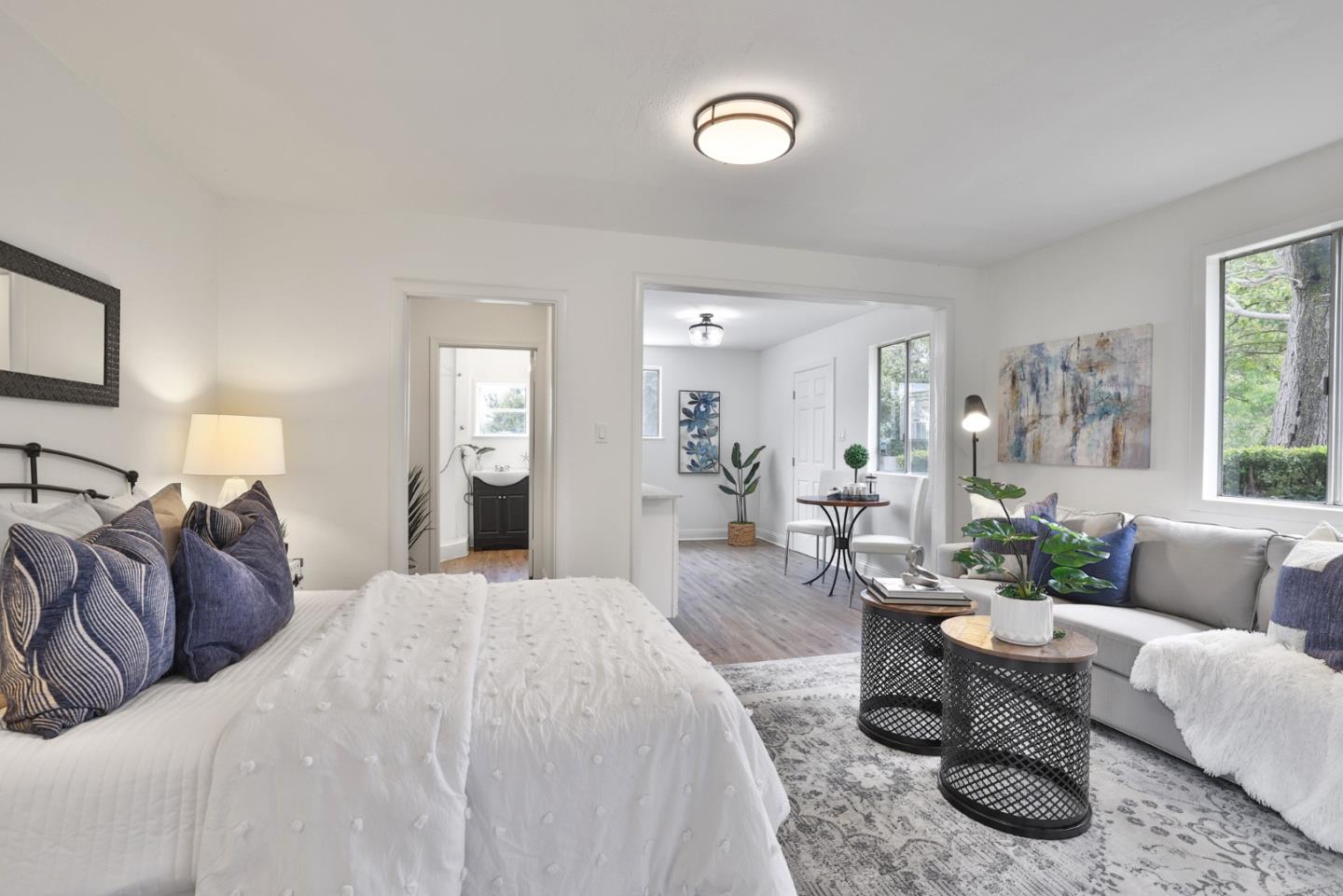 10036 Carmen Road Cupertino, CA 95014 - Photo 3 of 17 a living room with furniture and a large window