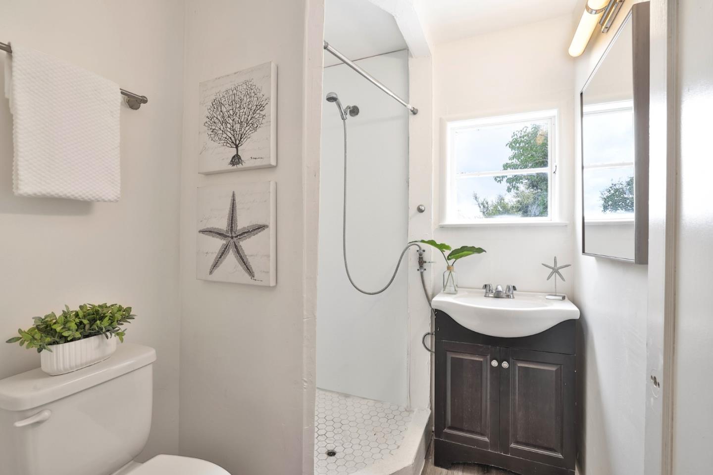 10036 Carmen Road Cupertino, CA 95014 - Photo 5 of 17 a bathroom with a sink toilet and shower