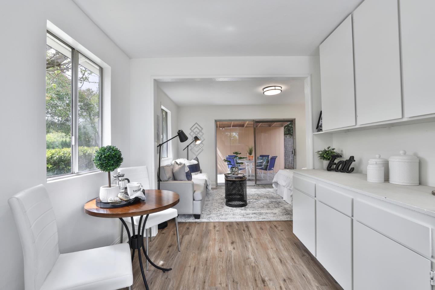 10036 Carmen Road Cupertino, CA 95014 - Photo 6 of 17 a view of a dining room with furniture and wooden floor