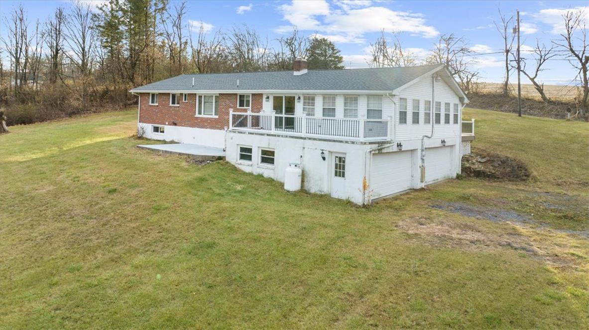 988 Hoch Road Danielsville, PA 18038 - Photo 29 of 29 Perched on a gentle slope, this residence features a broad, grassy yard and a spacious walk-out basement.