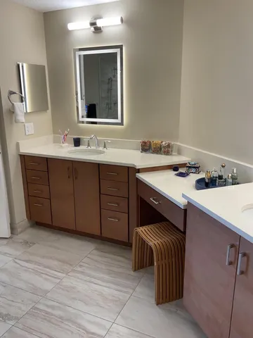 a room with a sink and a mirror