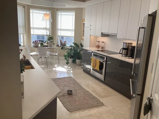 a kitchen with a sink stove and refrigerator