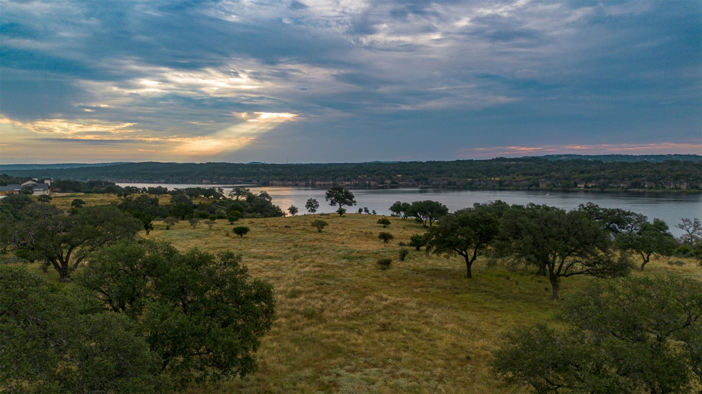 6 Dos Rios Way Marble Falls, TX 78654 - Photo 1 of 28 a view of a lake with houses in back