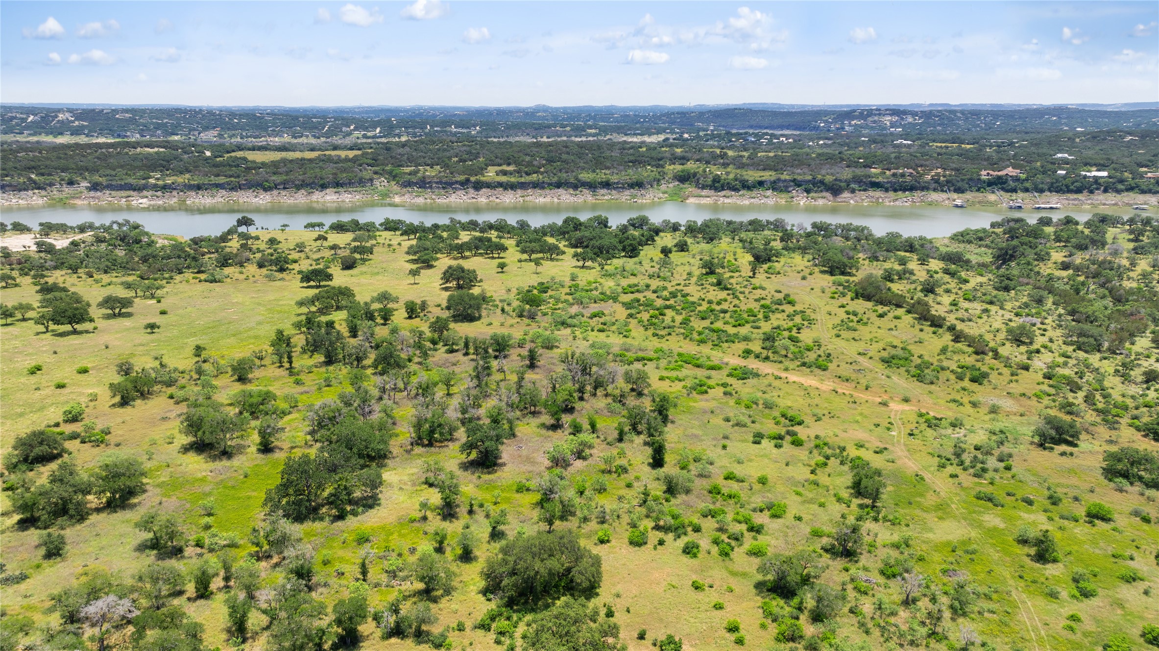 6 Dos Rios Way Marble Falls, TX 78654 - Photo 15 of 28 a view of a city with an ocean beach