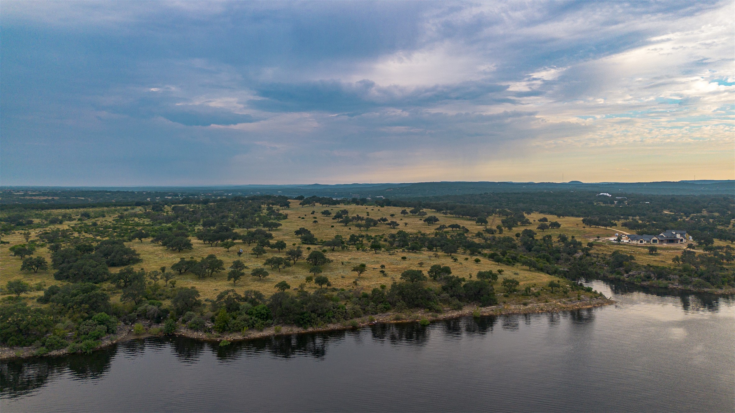 6 Dos Rios Way Marble Falls, TX 78654 - Photo 3 of 28 an aerial view of residential building with outdoor space and lake