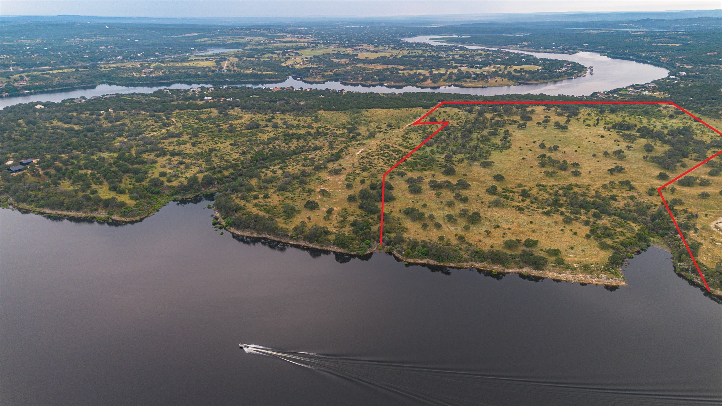 6 Dos Rios Way Marble Falls, TX 78654 - Photo 7 of 28 an aerial view of residential house with outdoor space and river