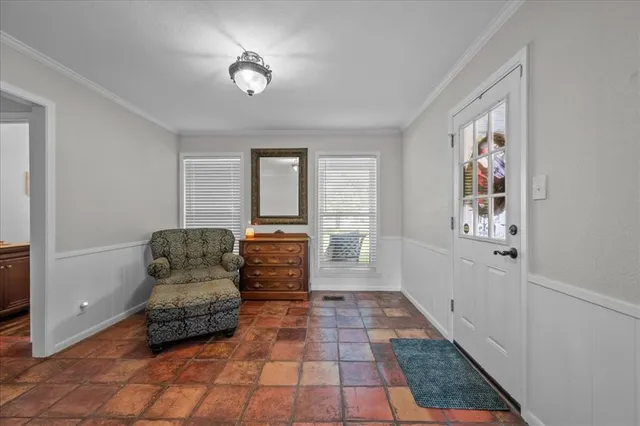 a living room with furniture and a rug