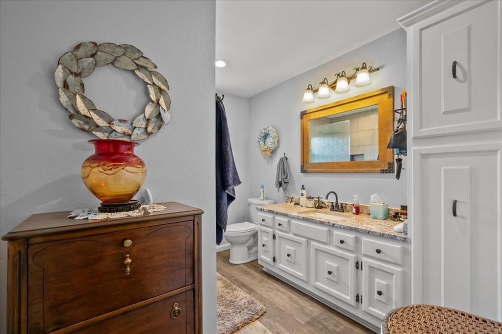 3400 Obrien Circle Waco, TX 76708 - Photo 20 of 36 a bathroom with a double vanity sink and a mirror