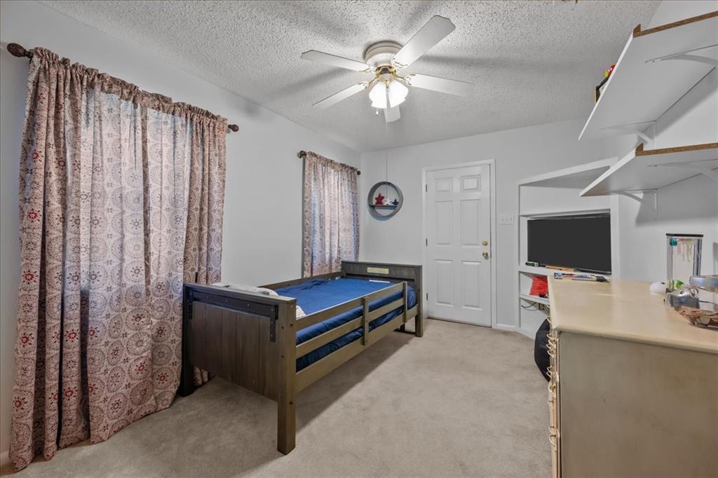 3400 Obrien Circle Waco, TX 76708 - Photo 24 of 36 a living room with furniture and a flat screen tv