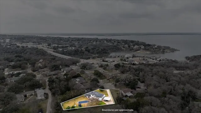 an aerial view of house with yard