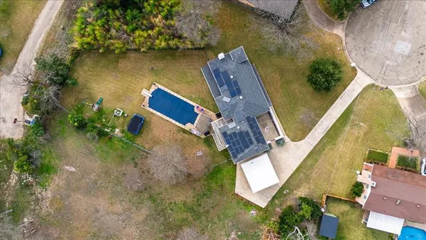 an aerial view of house with yard swimming pool and outdoor seating