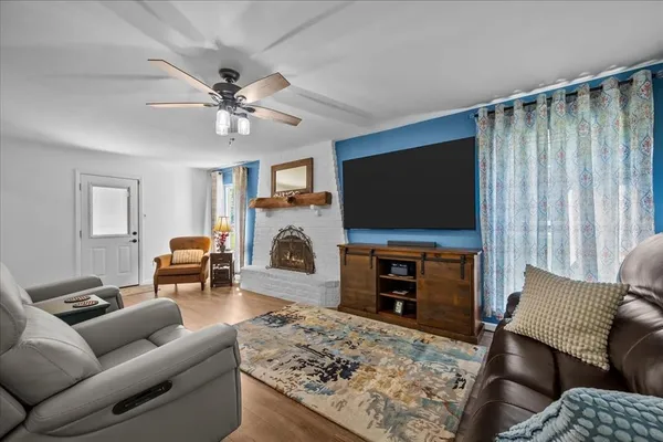 a living room with furniture and a flat screen tv