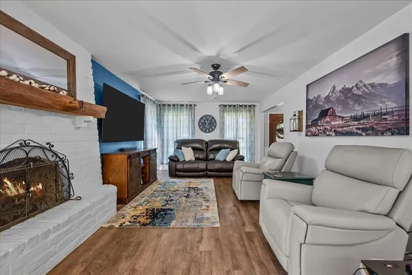 a living room with furniture and a fireplace