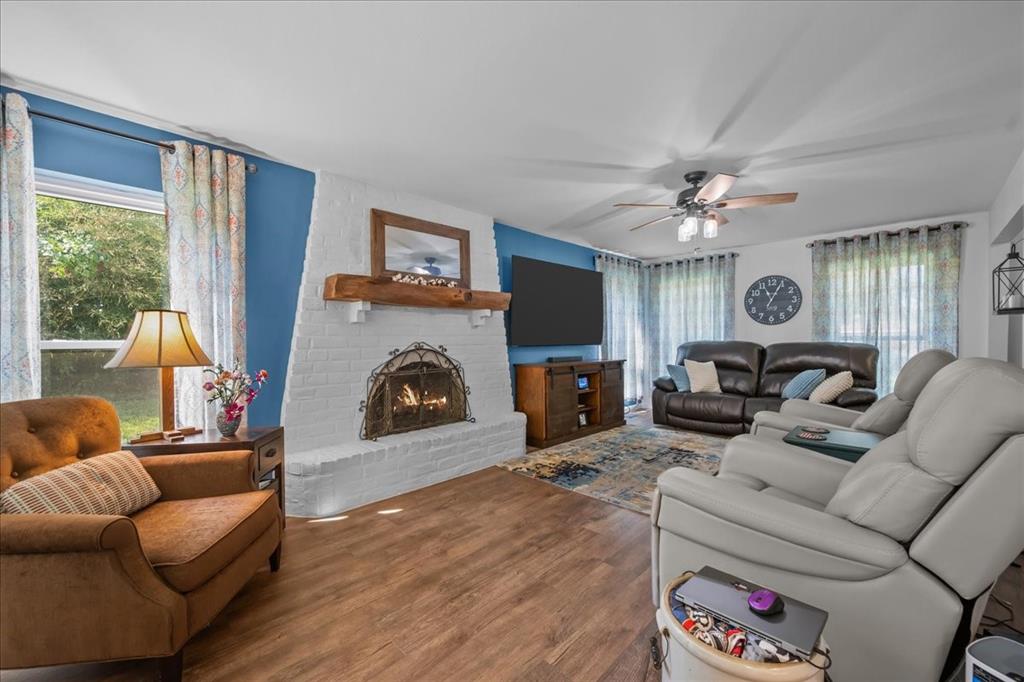 3400 Obrien Circle Waco, TX 76708 - Photo 10 of 36 a living room with furniture a fireplace and a flat screen tv