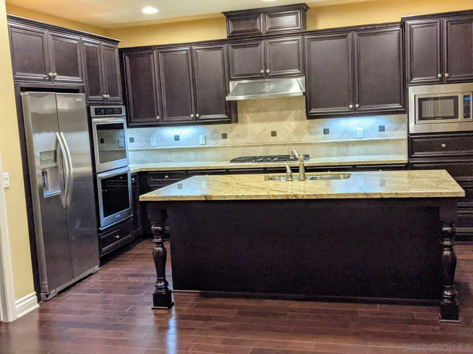 8490 Mathis Place San Diego, CA 92127 - Photo 6 of 14 a kitchen with stainless steel appliances granite countertop a stove a refrigerator and a microwave