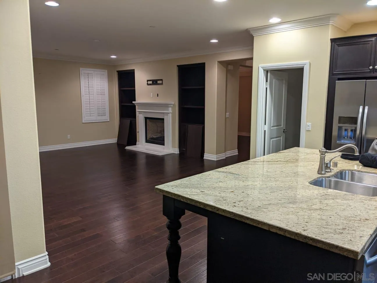 8490 Mathis Place San Diego, CA 92127 - Photo 8 of 14 a kitchen with kitchen island a sink appliances and a counter top space